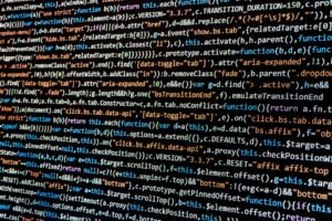 Close-up of colorful lines of website code on a screen, representing custom web development